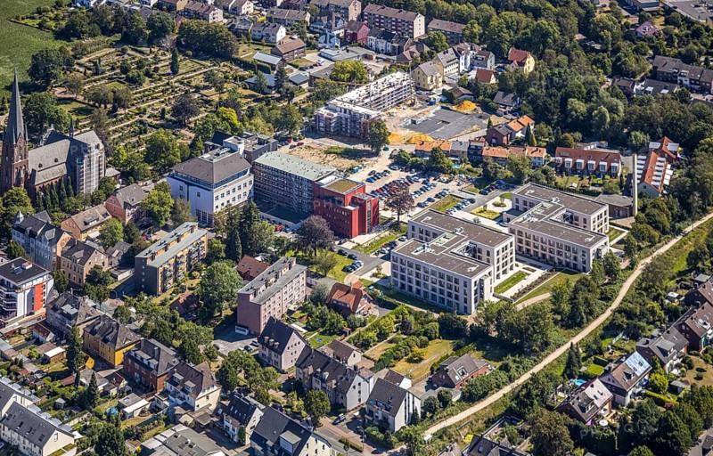 Aerial view, construction site Widumer Höfe, the future retirement home of the St Elisabeth Group, St Peter and Paul Catholic Church, Widumer Strasse Catholic Cemetery, Herne, Ruhr area, North Rhine-Westphalia, Germany. Widumer Straße cemetery, Herne, Ruhr area, North Rhine-Westphalia, Germany, retirement home, retirement home, retirement home, place of worship, construction work, construction, construction area, construction site, construction site, construction project, construction site, burial site, care and nursing, DE, Europe, cemetery, memorial site, religious community, place of worship, house of worship, crypt, graves, burial ground, church, parish, denomination, aerial view, aerial photography, aerial photography, Rhine-Ruhr metropolitan region, new building, care facility, religion, resting place, retirement home, retirement residence, retirement home, retirement centre, overview, bird's-eye view, bird's-eye view, overview
