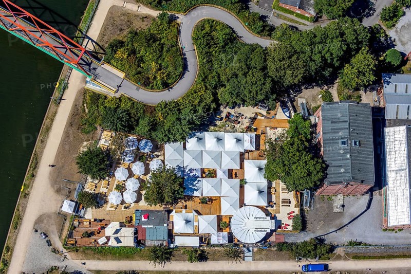 Aerial photo, Steinmeister's beer garden - Oskar am Kanal, Herne, Ruhr area, North Rhine-Westphalia, Germany, distance rule, beer garden, bridge, café, corona crisis, corona measures, corona virus, corona fear, Covid-19, DE, Europe, inn, gastronomy, hygiene measures, aerial view, aerial photography, aerial photography, Rhine-Ruhr metropolitan region, pandemic fear, Parrot Bridge - Unser Fritz, restaurant, Rhine-Herne Canal, parasols, overview, virus, bird's eye view, Zur Künstlerzeche, birds-eyes view, overview
