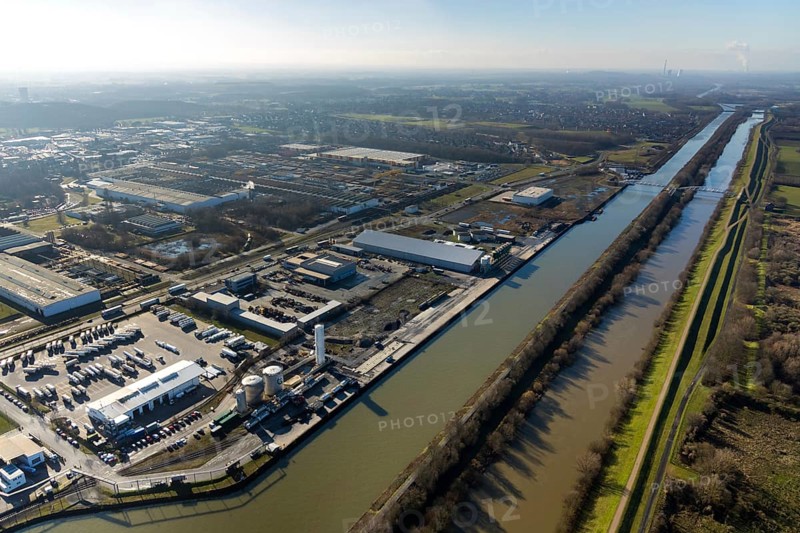 Aerial view, industrial area harbour Hamm between Hugo Schneider GmbH and Lanfer, Datteln-Hamm canal, river Lippe, Lippepark, bridge building in Lippepark, Hamm, Ruhr area, North Rhine-Westphalia, Germany, bridge, DE, Europe, river, river course, commercial area, commercial park, commercial use, industrial plants, industrial area, industrial site, canal, Lippe bridge, aerial view, aerial photography, aerial photography, production plants, production halls, overview, bird's eye view, birds-eyes view, overview