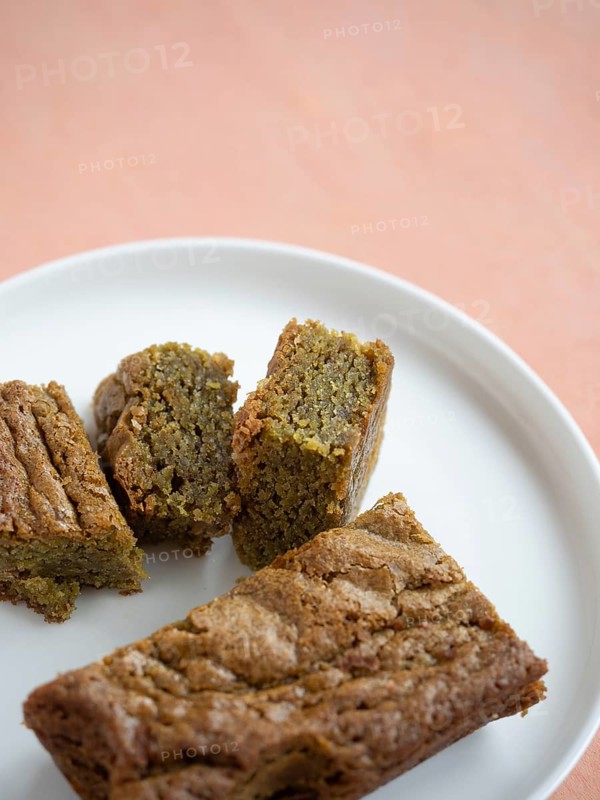Green tea blondie bars on a white plate ready for a sweet snack