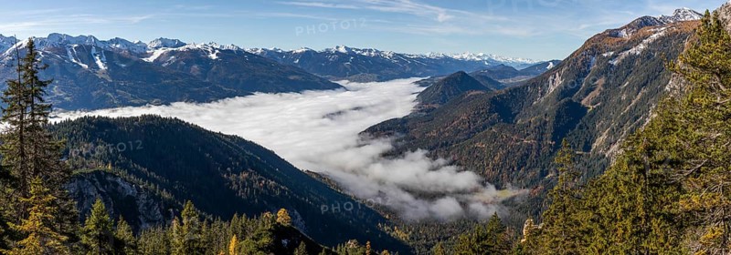Autumn atmosphere, fog over the Enns Valley, snow on alpine mountain range, autumn leaves, panoramic view from Stoderstraße, near Gröbming, Styria, Austria