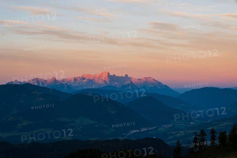 View from Mitterfeldalm to Hoher Dachstein at sunset, the Tauern motorway in the valley, Salzburg state, Austria