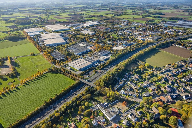 Aerial view, Oberster Kamp industrial estate on the A2 motorway, meadow area surrounded by autumn tree-lined avenue on the A2 motorway, meadows and fields with a distant view, Wambelner Straße bridge over the motorway, Rhynern district, Hamm, Ruhr area, North Rhine-Westphalia, Germany, DE, Europe, commercial establishment, commercial area, commercial property, industrial site, commercial use, industrial area, industrial location, air photography, aerial photography, aerial photography, overview, bird's eye view, overview