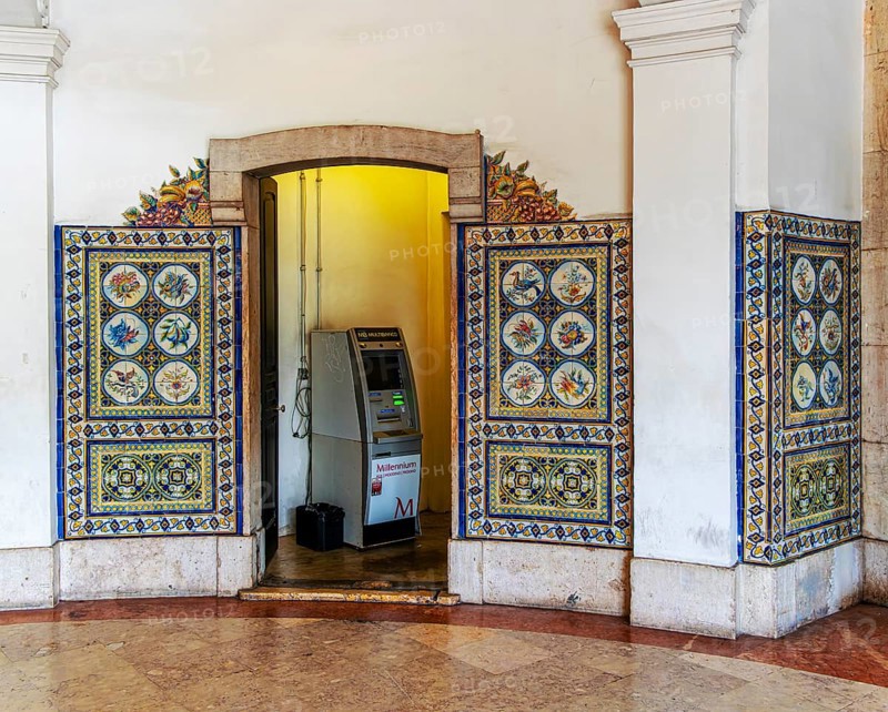 Cash machine at the entrance to r Mercadeo da Ribeira, also known as TimeOut Market, the best address for Portuguese specialties and international cuisine. Historic market hall at Cais do Sodré railway station, Lisbon, Portugal