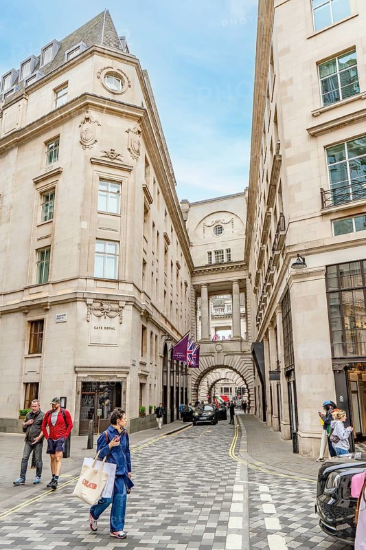 London, United Kingdom - 15 May 2025: Elegant neoclassical architecture lining the luxury Hotel Cafe Royal