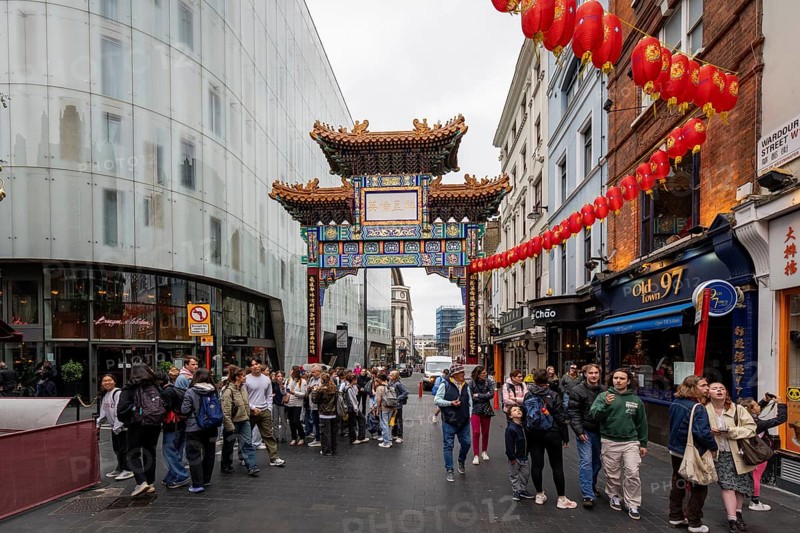 London, United Kingdom - 15 May 2025: Iconic paifang gate marking the vibrant entrance to London's busy chinatown district