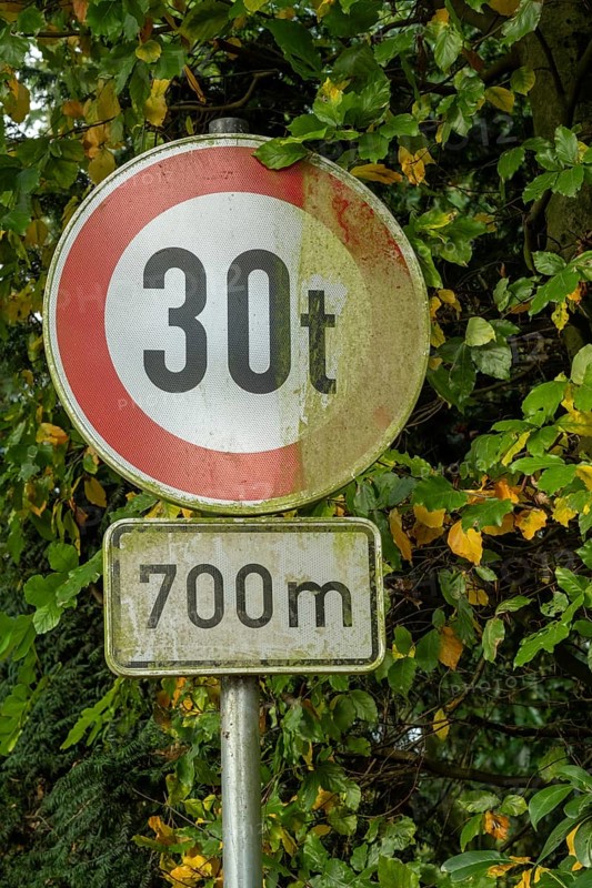 Raesfeld, NRW, Germany, Old traffic sign indicating a 30-ton weight limit ahead for 700 meters