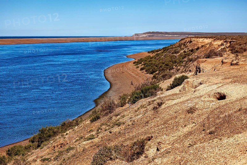 Estuary into the sea with rocky coast and extensive landscape, The landscape of Peninsula Valdes in Argentina