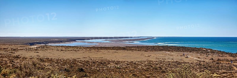 Pristine coastal plain extending into the expanse of the blue sea, the countryside of Peninsula Valdes in Argentina
