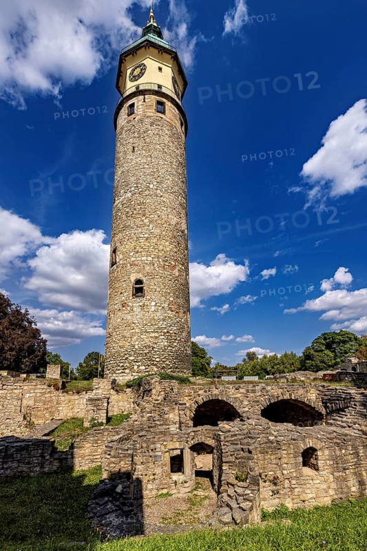 High stone tower against a cloudy blue sky, The Niedeck Ruins in Arnstadt Thuringia