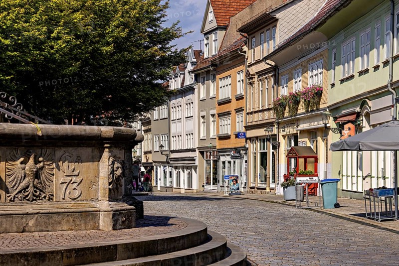 Historic street with facades and a fountain on the cobblestones, The old town of Arnstadt in Thuringia