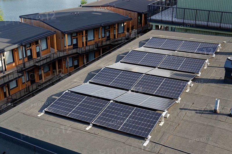 Solar panels on roof of apartment building, renewable green sustainable energy concept, water cooling, aerial view, Gothenburg, Sweden