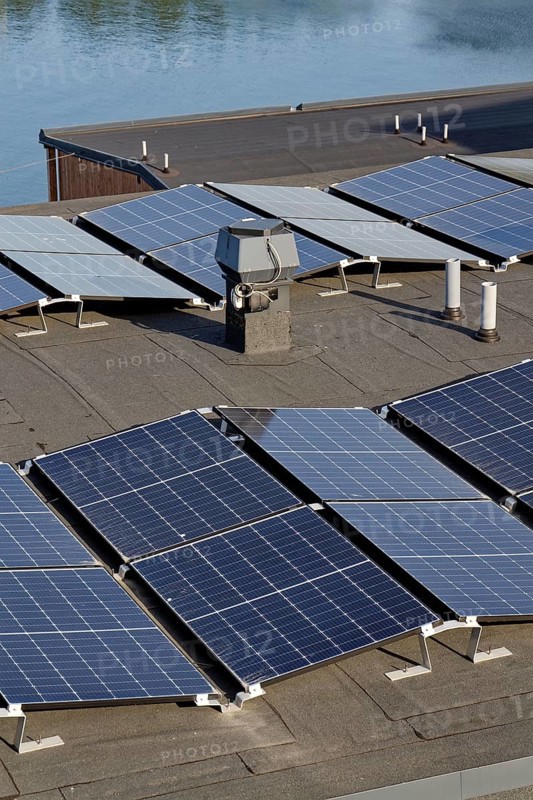 Solar panels on roof of apartment building, renewable green sustainable energy concept, water cooling, aerial view, Gothenburg, Sweden
