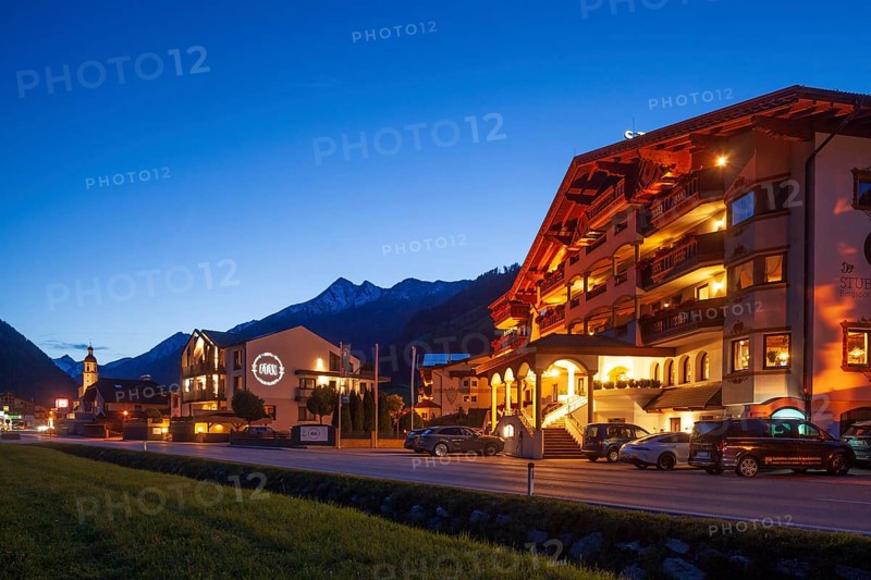 View of town with Hotel Stubaier Hof at dusk, Neustift im Stubai Valley, Stubai Valley, Stubai, Tyrol, Austria