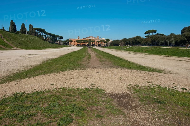 View of today green embankment former spina central element of in Circus Maximus venue of chariot races towards the ancient southeast bend and former start area, Rome, Lazio, Italy