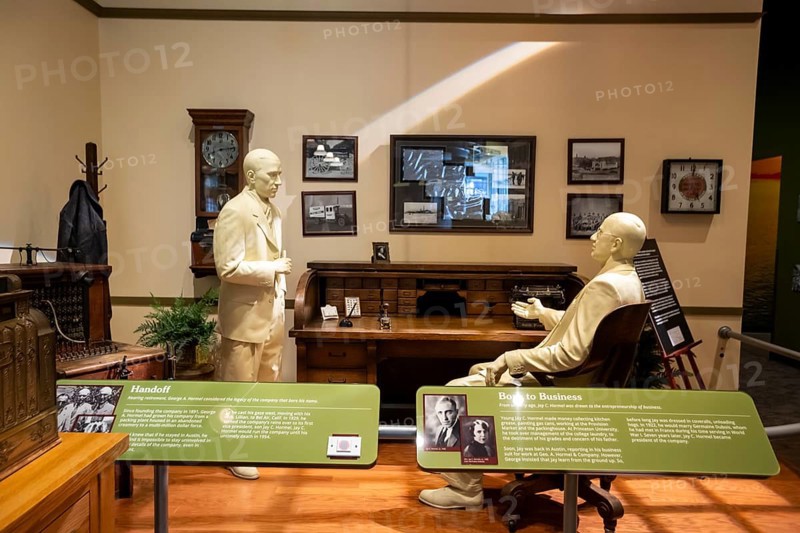 Austin, Minnesota - The SPAM Museum. SPAM is a lunch meat made of pork and ham, canned by Hormel Foods. A display shows Hormel founder George A. Hormel handing control of the company to his son, Jay C. Hormel