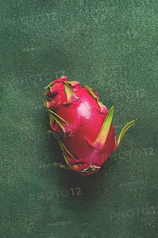 Dragon fruit, pitahaya, one piece, top view, rustic style, green background