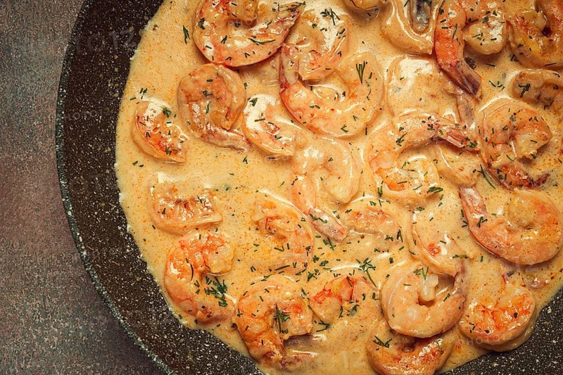 Shrimp in creamy garlic sauce, with spices and herbs