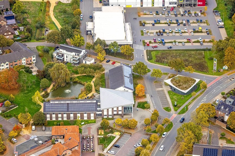 Aerial view, City Hall, solar roof and pond with fountain, Volksbank branch with green roof, Bedburg, Bedburg-Hau, Lower Rhine, North Rhine-Westphalia, Germany