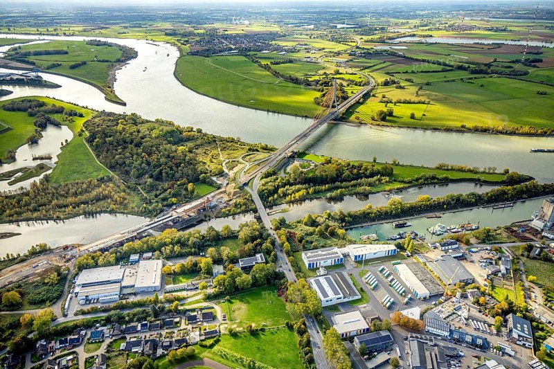 Aerial view, Lippe bridge construction site, new bridge over the river Lippe for connection to the federal road B58 and Lower Rhine bridge Wesel with river Rhine, Wesel, Lower Rhine, North Rhine-Westphalia, Germany, construction site, building plots, construction project, construction site, trees in autumn colors, DE, Europe, autumn, autumn colors, autumn atmosphere, autumn forest colors, aerial photography, aerial photography, new building, overview, bird's eye view, birds-eyes view, autumn trees, overview