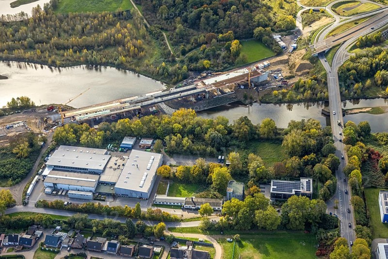 Aerial view, Lippe bridge construction site, new bridge over the river Lippe for connection to the federal road B58 and the Lower Rhine bridge Wesel, Wesel, Lower Rhine, North Rhine-Westphalia, Germany, construction area, building plot, construction project, construction project, construction site, trees in autumn colors, DE, Europe, autumn, autumn colors, autumn forest colors, aerial photography, aerial photography, new building, overview, bird's eye view, birds-eyes view, autumn trees, overview