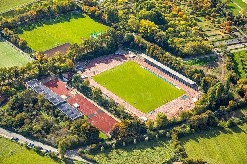 Aerial view, Auestadion Wesel, soccer stadium and athletics stadium, surrounded by autumn trees, building with solar roof, Wesel, Lower Rhine, North Rhine-Westphalia, Germany, DE, roof with solar panels, Europe, soccer field, soccer stadium, aerial view, aerial photography, aerial photography, side seats, photovoltaic system, solar roof, solar energy, solar panels, solar power sports complex, sports complex, sports field, grandstand, overview, bird's eye view, birds-eyes view, overview