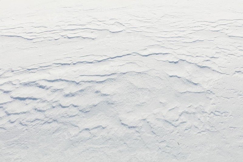 Wind has made patterns on snow surface, Toronsuo National Park, Tammela, Finland