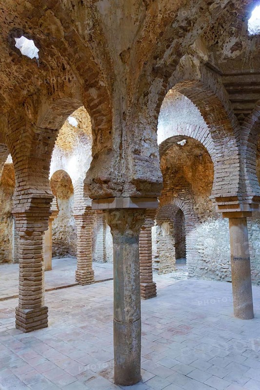 Ronda, malaga, spain Arab baths interior in ronda, spain, with ancient brick arches, stone columns, and vaulted ceilings. Historic moorish architecture