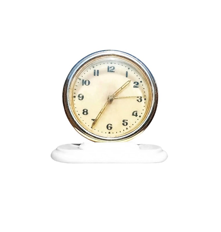 Old soviet antique vintage table clock on a white background