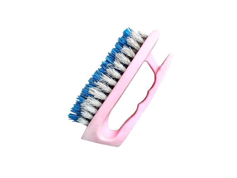 Old plastic shoe cleaning brush on white background