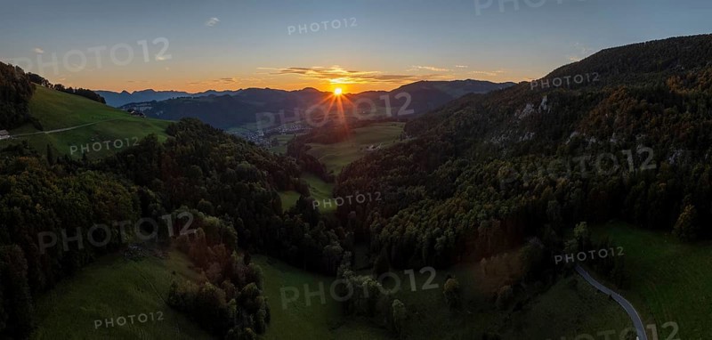 Sunset between the first and second Jura ranges, drone shot, Breitehöchi, Mümliswil, Solothurn, Switzerland