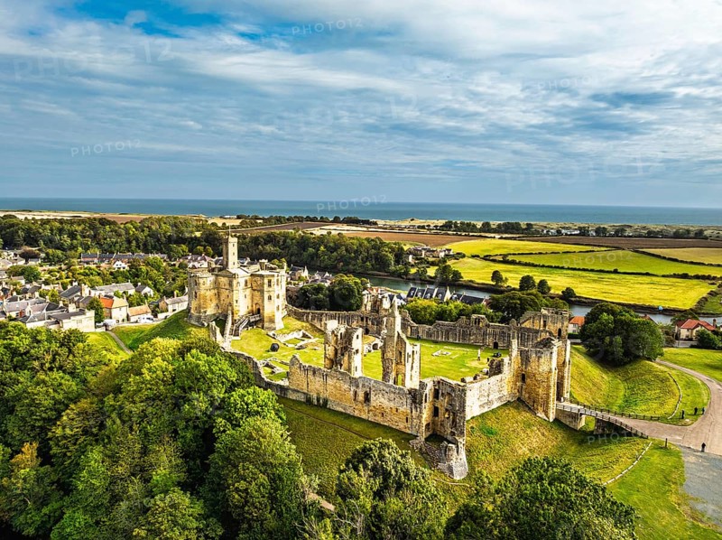 Warkworth Castle over River Coquet from a drone, Warkworth, Northumberland, England, United Kingdom