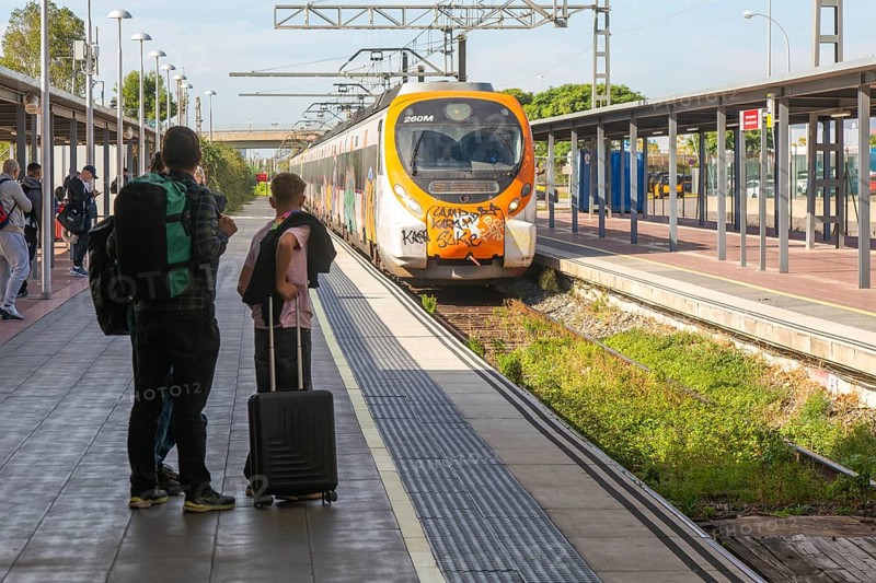 Renfe Civia commuter train at platform of Airport railway station, Rodalia de Barcelona suburban rail network, Barcelona, Catalonia, Spain