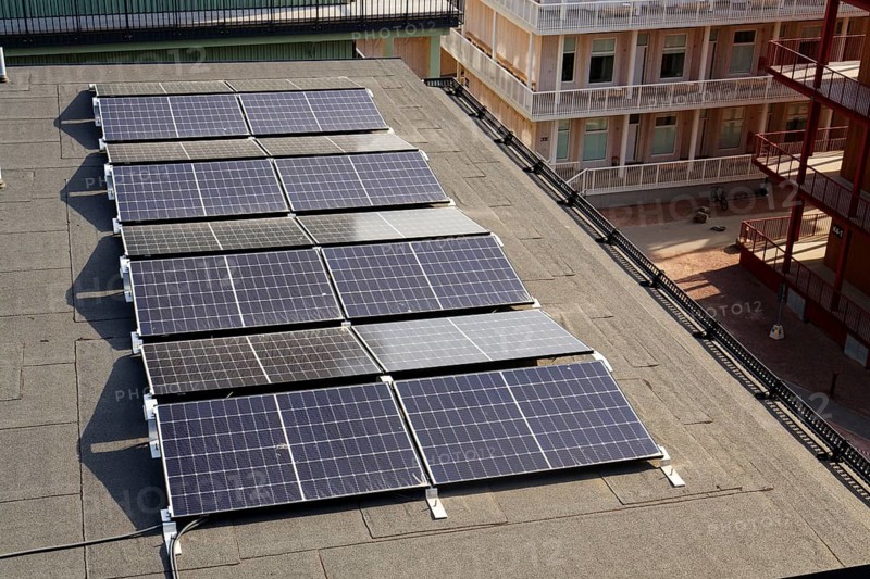 Solar panels on roof of apartment building, renewable green sustainable energy concept, water cooling, aerial view, Gothenburg, Sweden