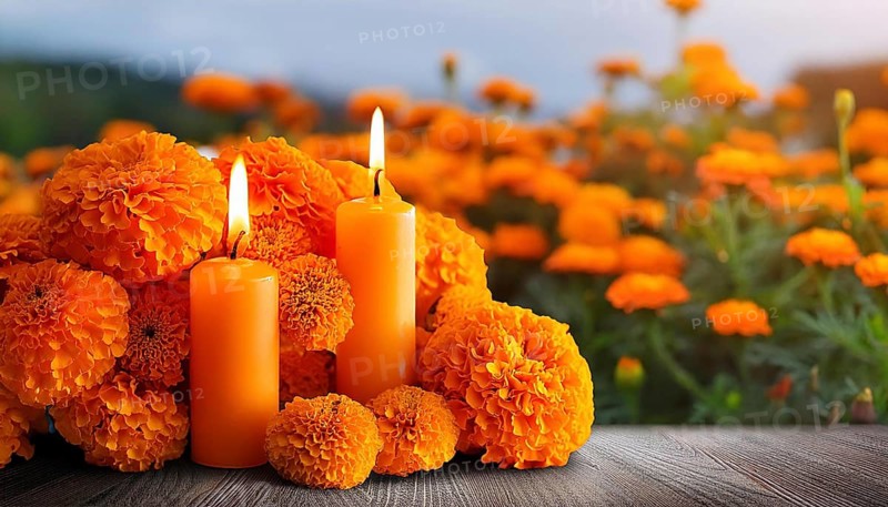 Two lit candles surrounded by vibrant marigolds, set on a wooden surface, creating a serene atmosphere for Day of the Dead remembrance, AI generated