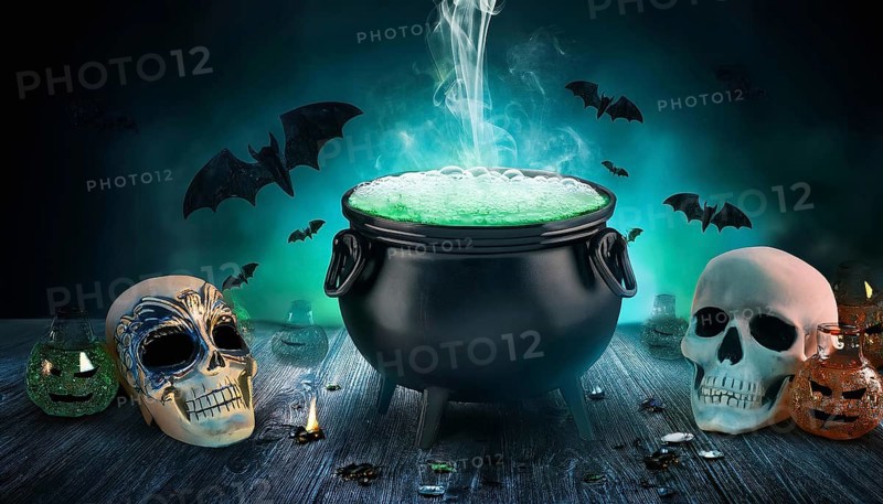A bubbling cauldron emits green smoke, surrounded by skulls and bats in a spooky Halloween setup. The eerie scene is completed with glowing potions and dark, atmospheric lighting, AI generated