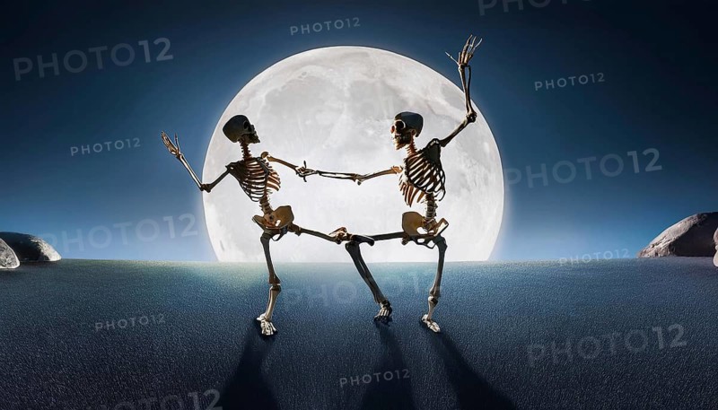 Two skeletons dance under a bright full moon, casting long shadows on the ground, creating a spooky Halloween scene, AI generated