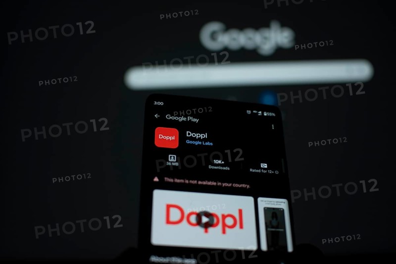 Smartphone showing Doppl app page on Google Play with Google in the background
