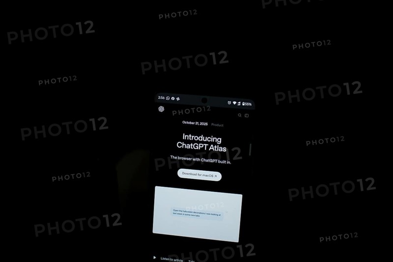 Smartphone displaying ChatGPT Atlas text in a dark setting