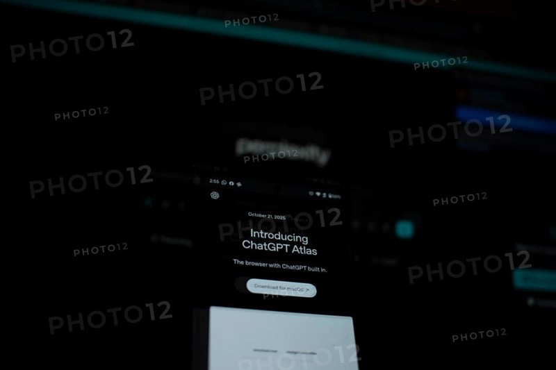 Dimly lit smartphone screen showing ChatGPT Atlas details