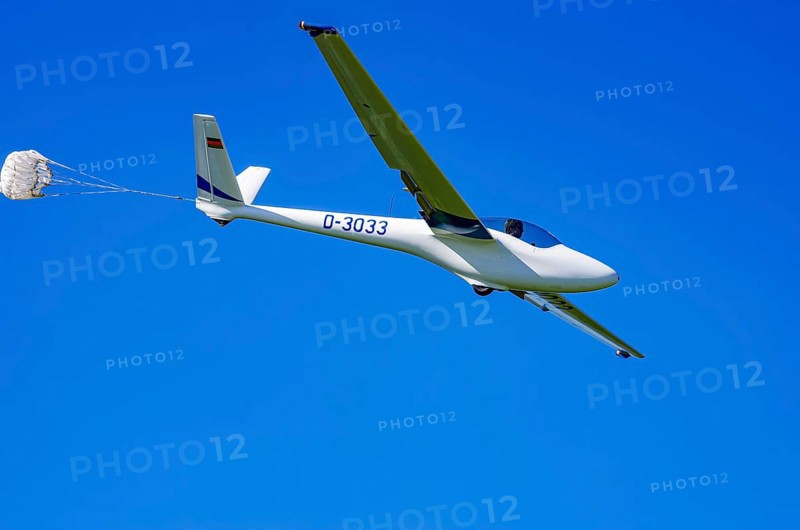 A Hänle H-101 somersault glider, registration D-3033, during a demonstration as part of an air show at the Fliegerbergfest of the Rossfeld Luftsportverein in Metzingen-Glems, Baden-Württemberg, Germany, for editorial use only
