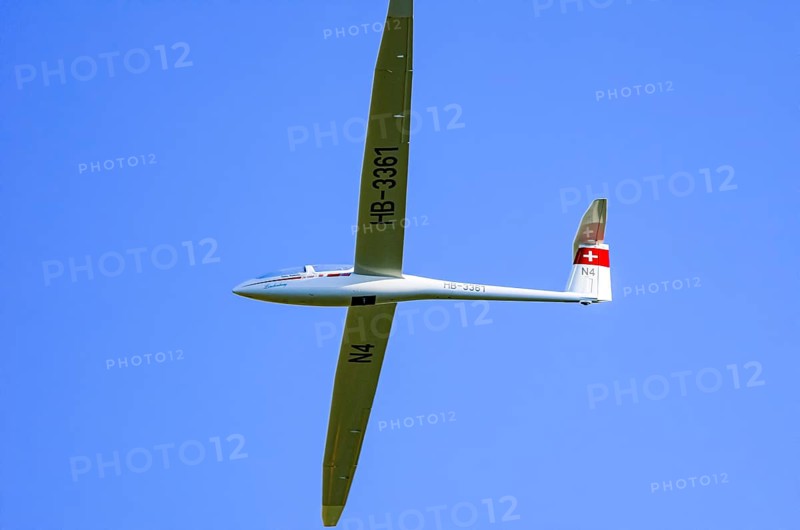 A DG Flugzeugbau glider DG-1000, registration HB-3361, during a demonstration as part of an air show at the Fliegerbergfest of the Rossfeld Luftsportverein in Metzingen-Glems, Baden-Württemberg, Germany, for editorial use only