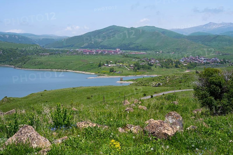 Wide view of a lake surrounded by green hills and mountains under a blue sky, Kechut, Kushchi, Kush-Bilyak, and Kechut Reservoir, Wajoz Dzor Province, Vayots Dzor, Armenia