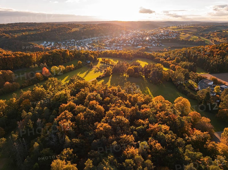 Dense forests and a wide view of a small town settlement in the distance, Aidlingen, Böblingen district, Germany