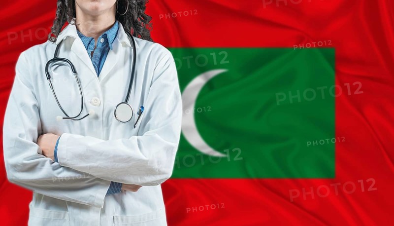 Medical professional on Maldivian flag. Healthcare and wellness in Maldives, Concept