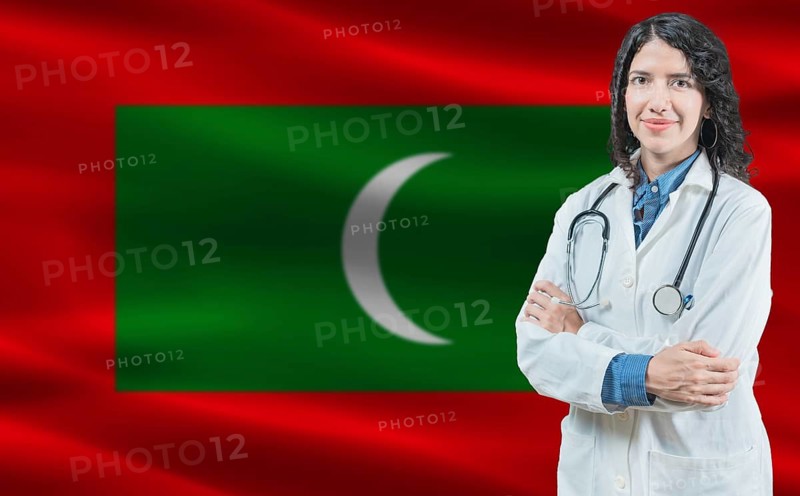 Maldivian medicine and healthcare concept. Close up of doctor against Maldivian flag background
