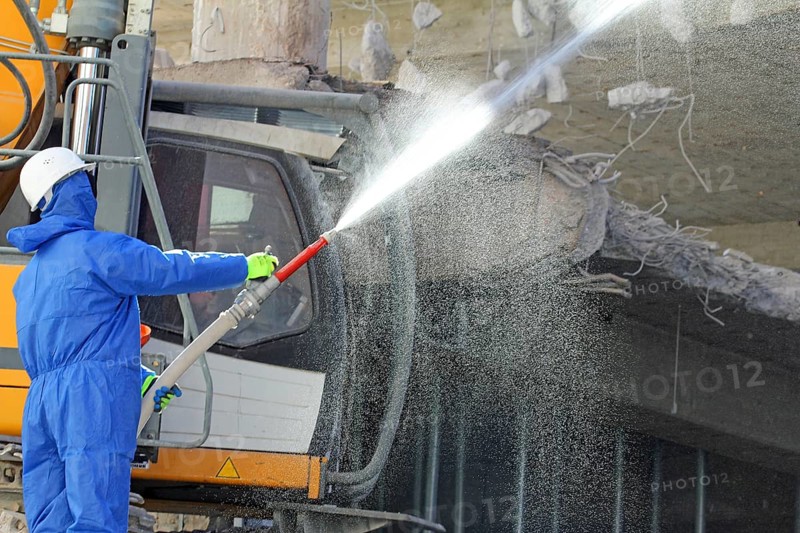 Demolition work in building construction. water jet against dust and dirt. Paderborn, North Rhine-Westphalia, Germany