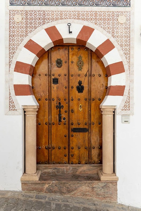 On the road to the white villages. Beautiful doors of the historic old town in Setenil de las Bodegas, Cadiz, Andalusia, Spain