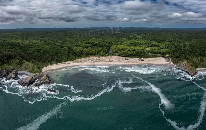 Panoramic view of a beach with crashing waves and dense forests. Aerial view to beautiful Silistar beach near to Sinemorec, Burgas, Bulgaria