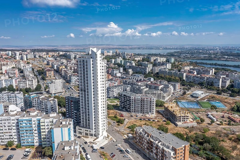 Aerial view of a city with tall buildings and roadways. Aerial view to the skyscraper in the Meden Rudnik district, Burgas, Bulgaria